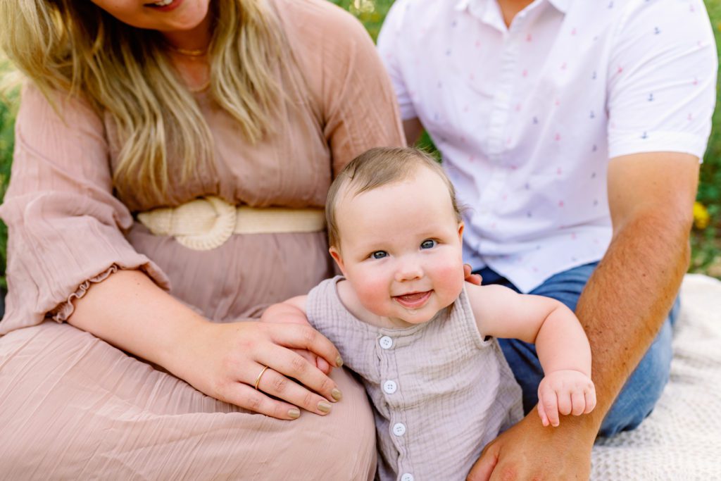 baby sitting with parents during wildflower family session