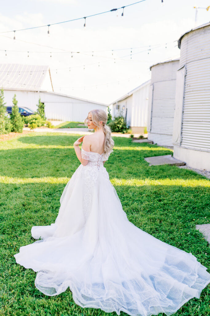 bridal portrait framed by silos at a farm