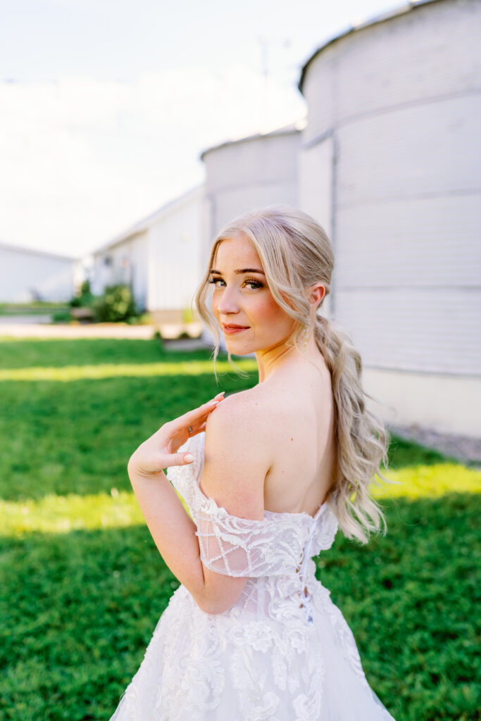 portrait of a bride with the silos at historic white oak farm