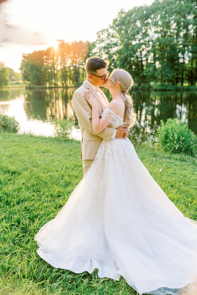 bride and groom at sunset portraits by the lake