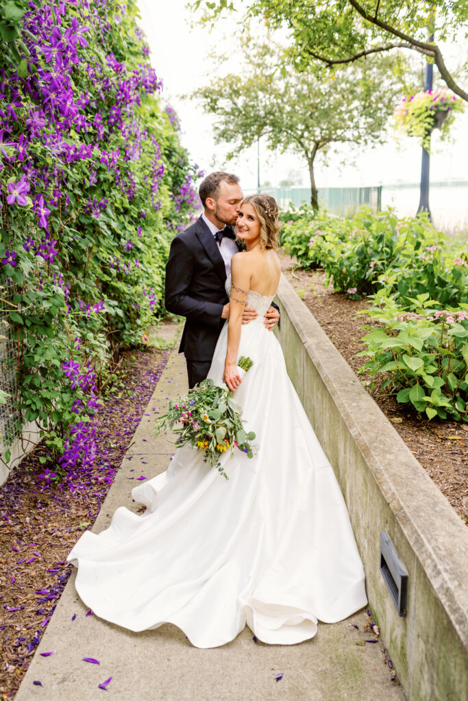 bride and groom at riverscape for wedding portraits
