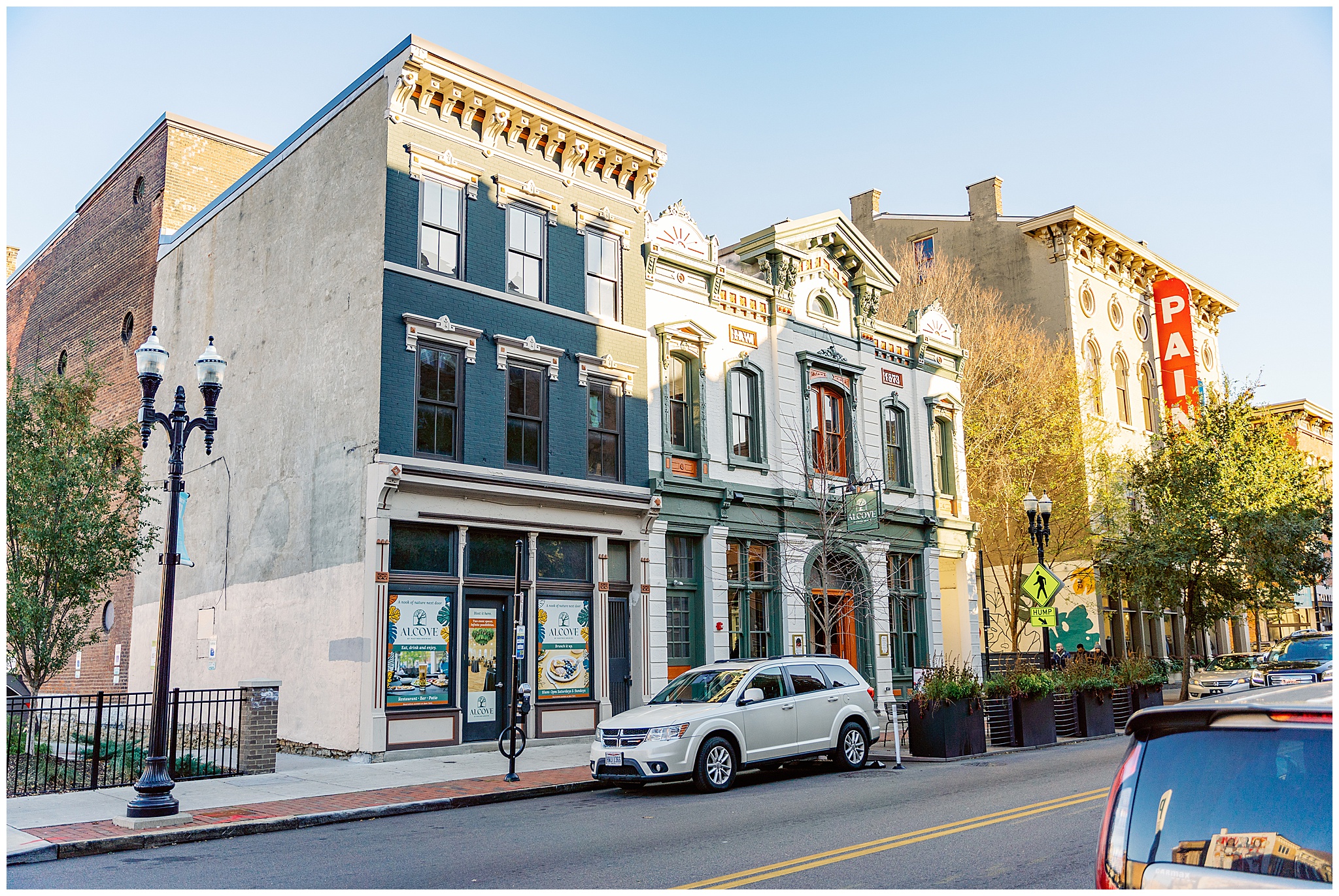 The front facade of the ornate white and green madtree alcove wedding venue