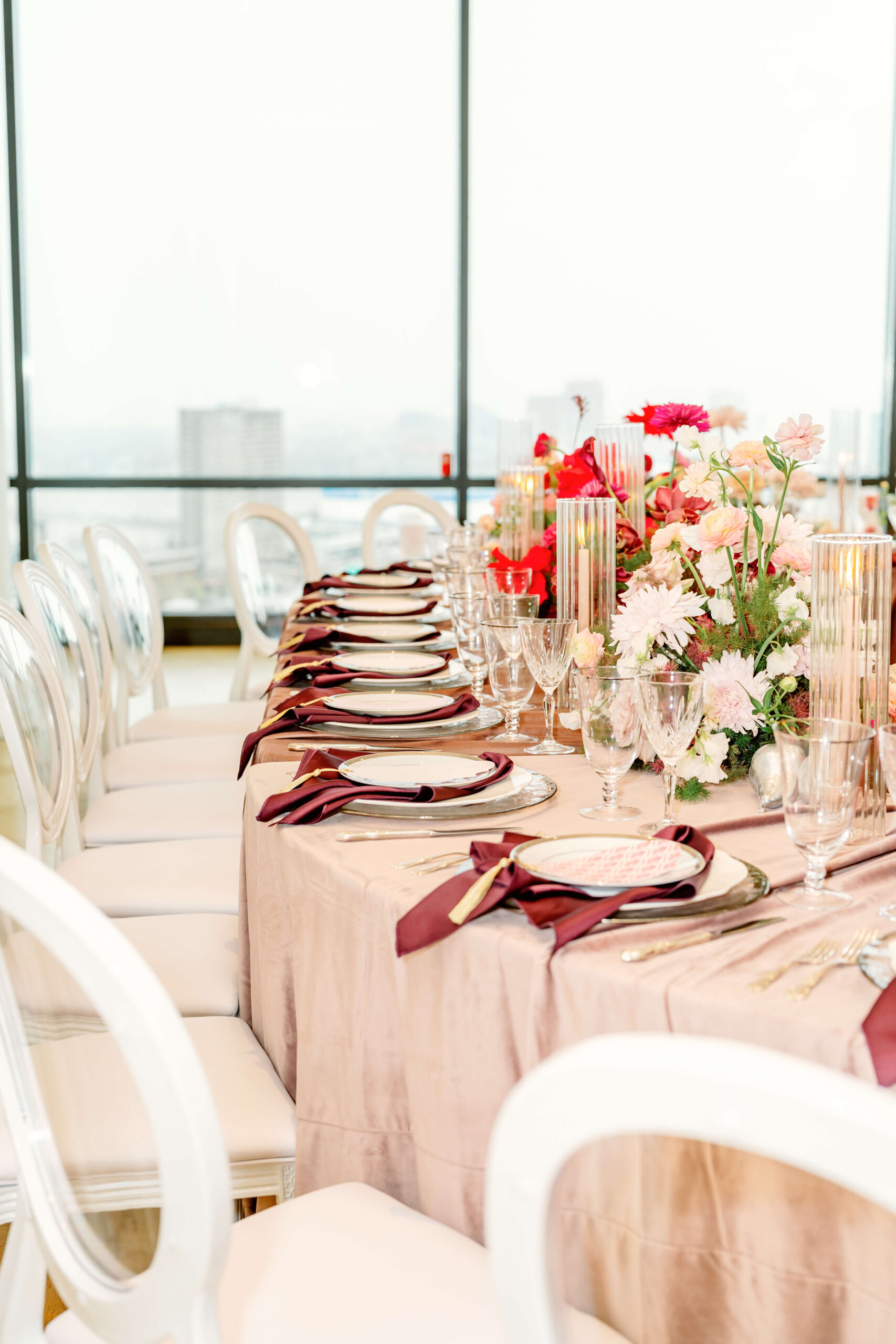 Details of a curved wedding reception table in a high rise with a view