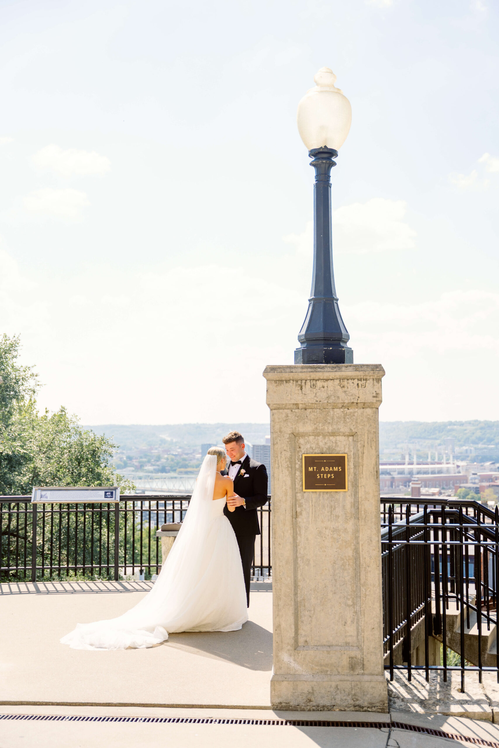 Newlyweds share a quiet moment on Mt. Adams Steps at one of the cincinnati wedding venues with a view