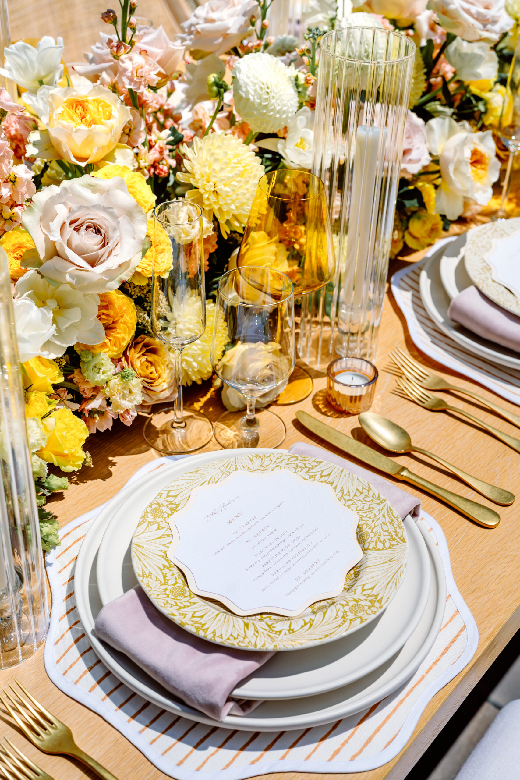 close up of the plates and napkins on a tablescape at an estate wedding venue