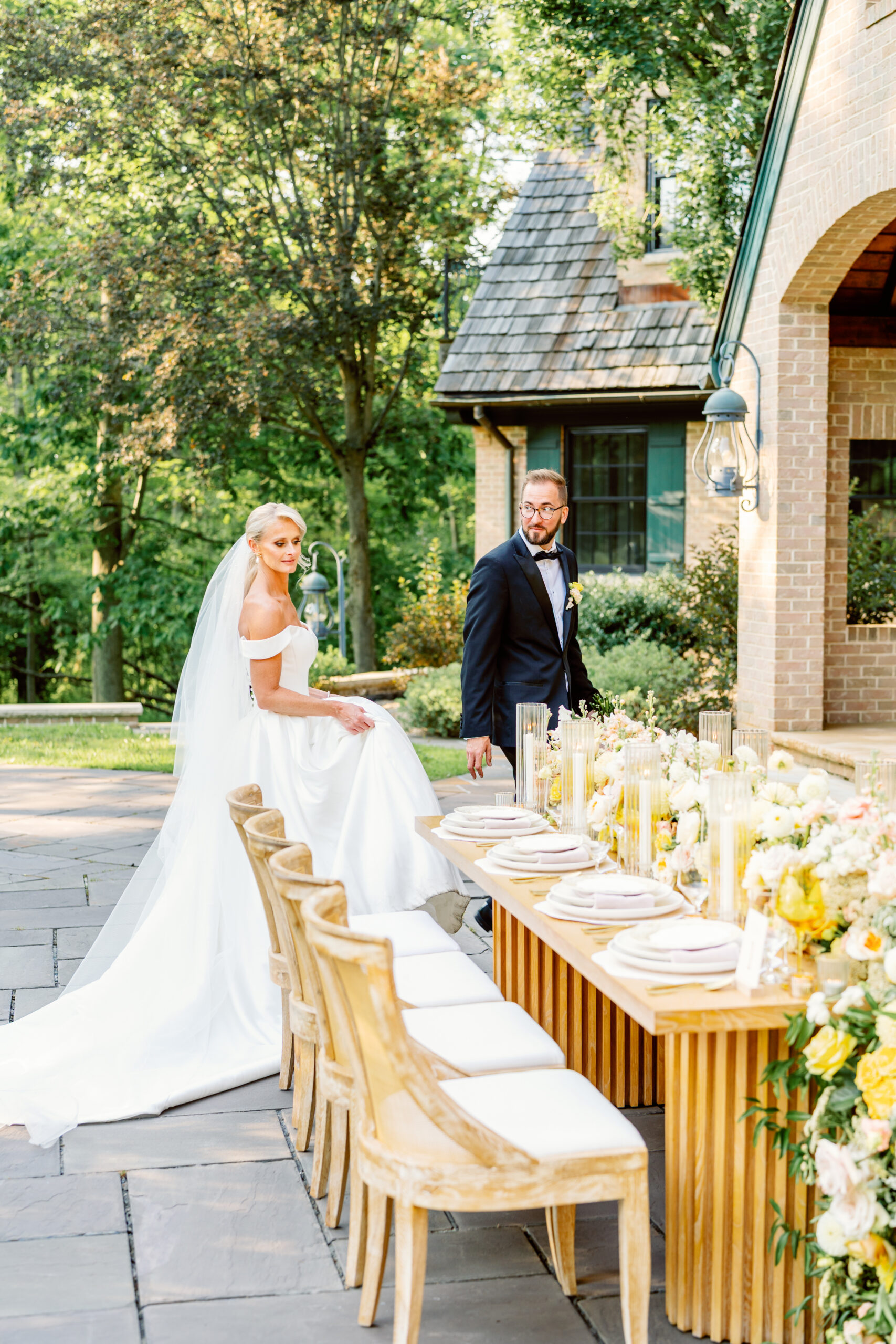 bride and groom checking out their reception table
